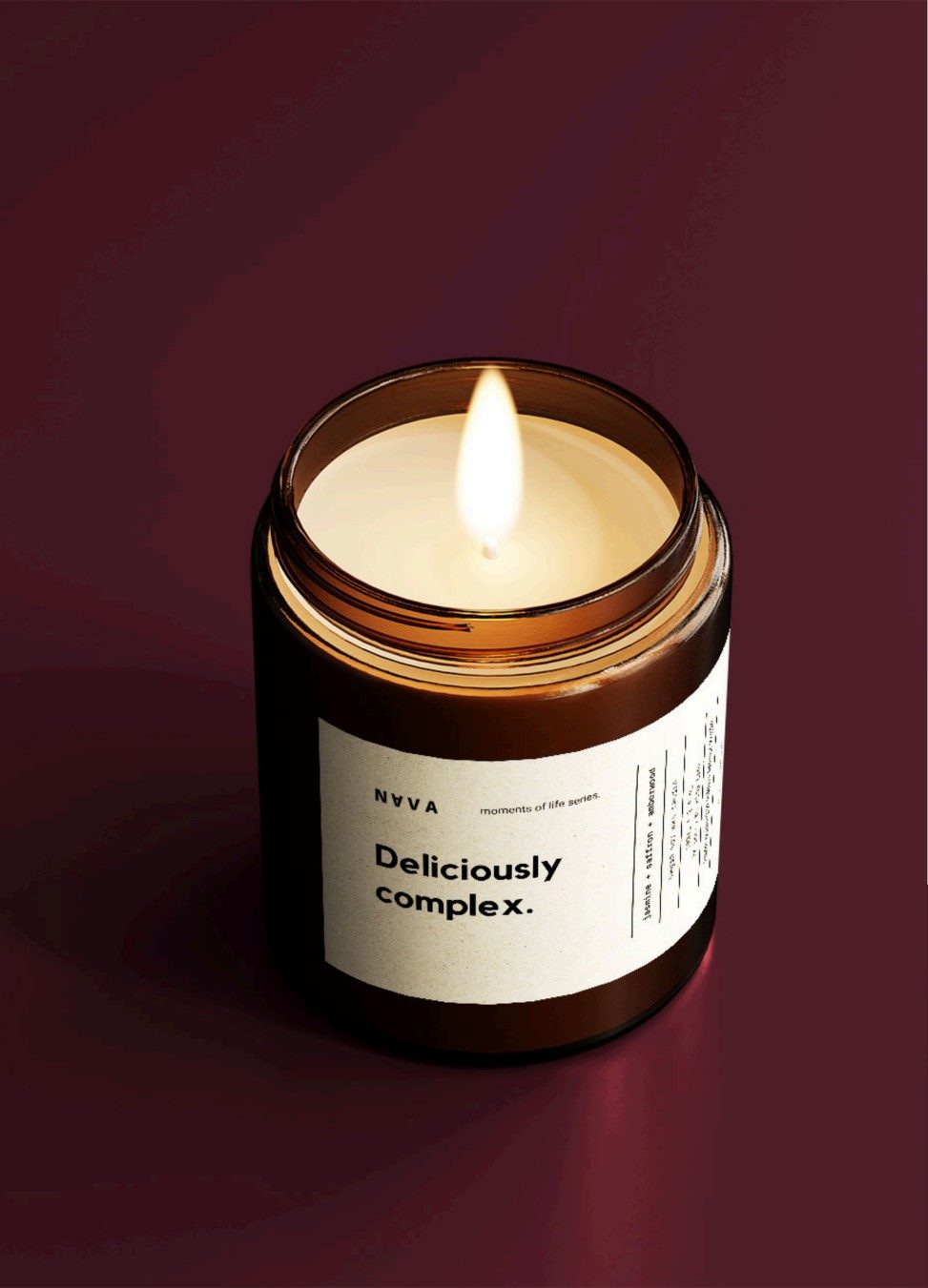 Deliciously Complex candle on maroon